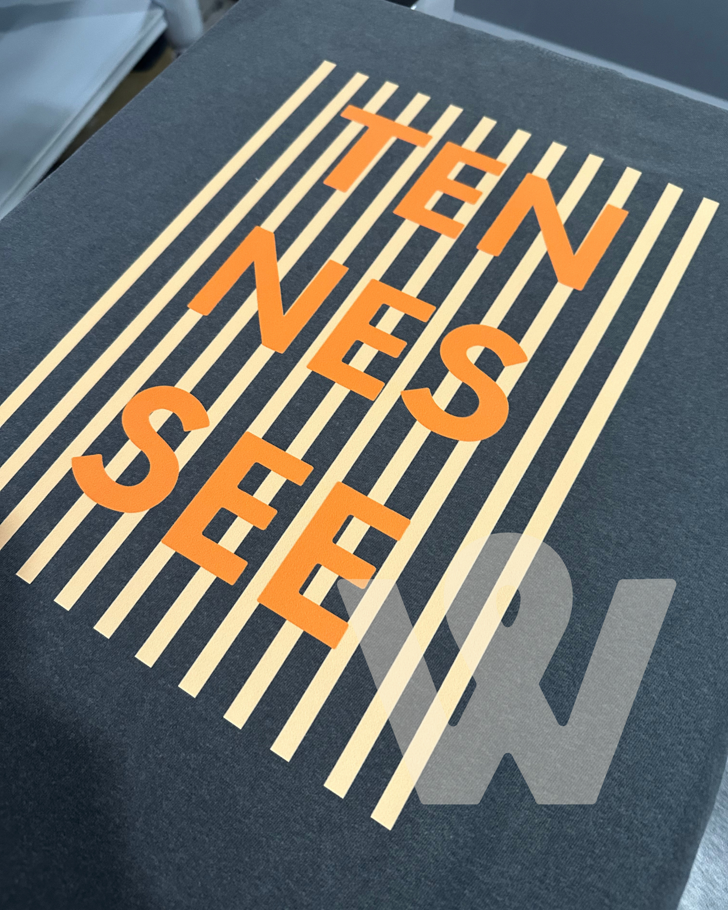 TENNESSEE striped background- pepper tee